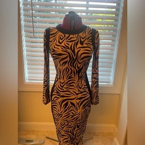 Gently used, leopard print midi sheath dress. Size Small